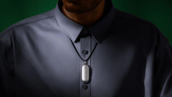 Plaud's NotePin hanging around a person's neck